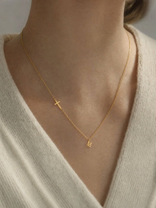 SAINT GILD initial cross necklace on neck