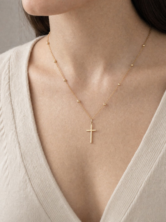 SAINT GILD Beaded Cross Necklace on neck
