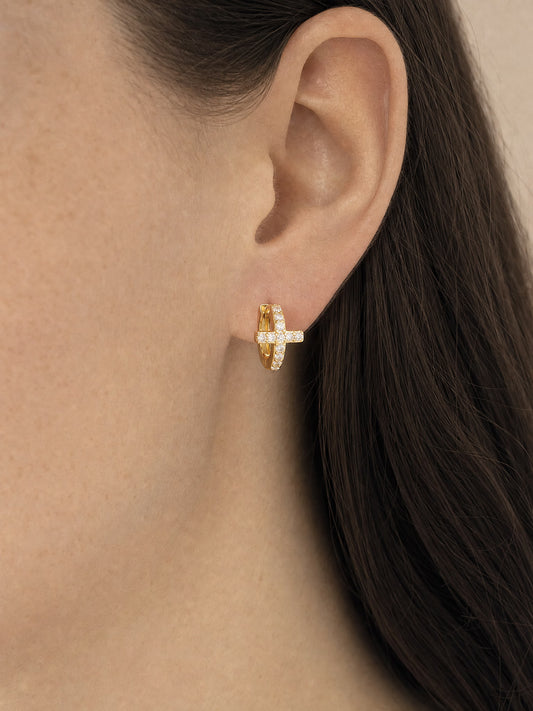 SAINT GILD Pave Cross Huggie Earrings on ear