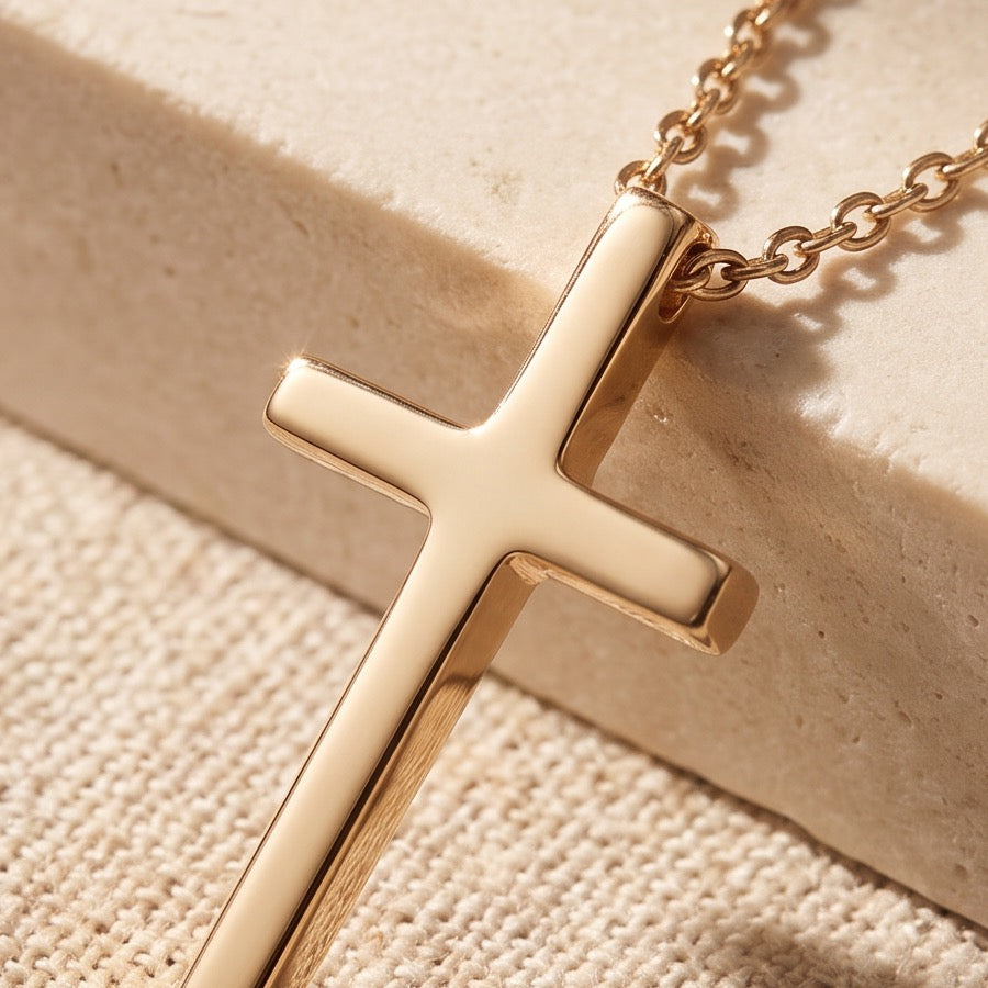 Gold cross pendant on stone