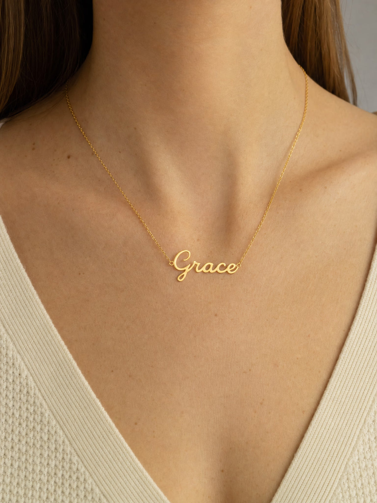 SAINT GILD name necklace worn on body