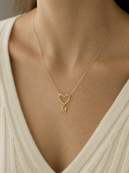 SAINT GILD initial heart necklace on neck