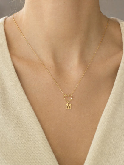 SAINT GILD initial heart necklace worn on body