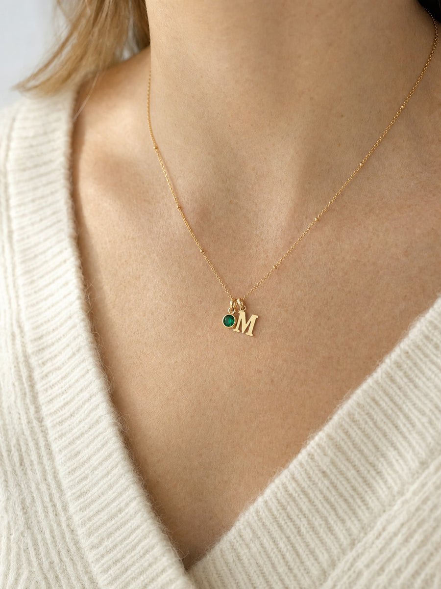 SAINT GILD initial birthstone necklace on neck