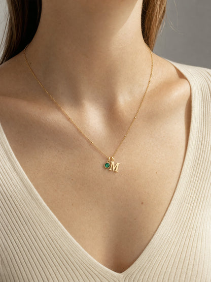 SAINT GILD initial birthstone necklace worn on body