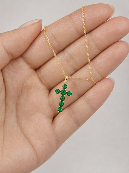SAINT GILD birthstone cross necklace in hand