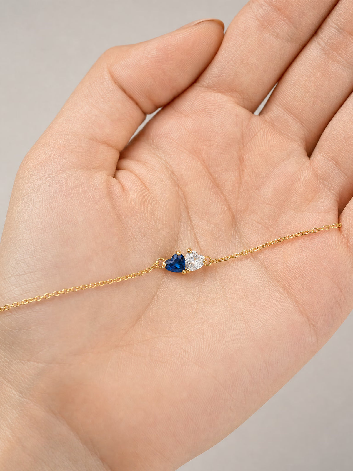 SAINT GILD two birthstone bracelet in hand