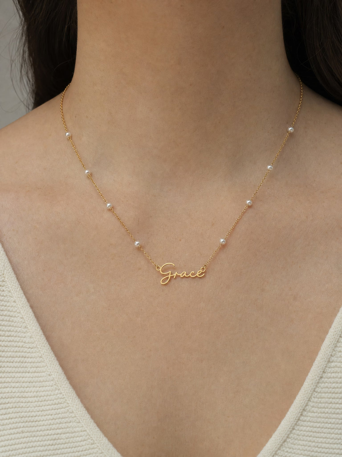 SAINT GILD faux pearl name necklace worn on body