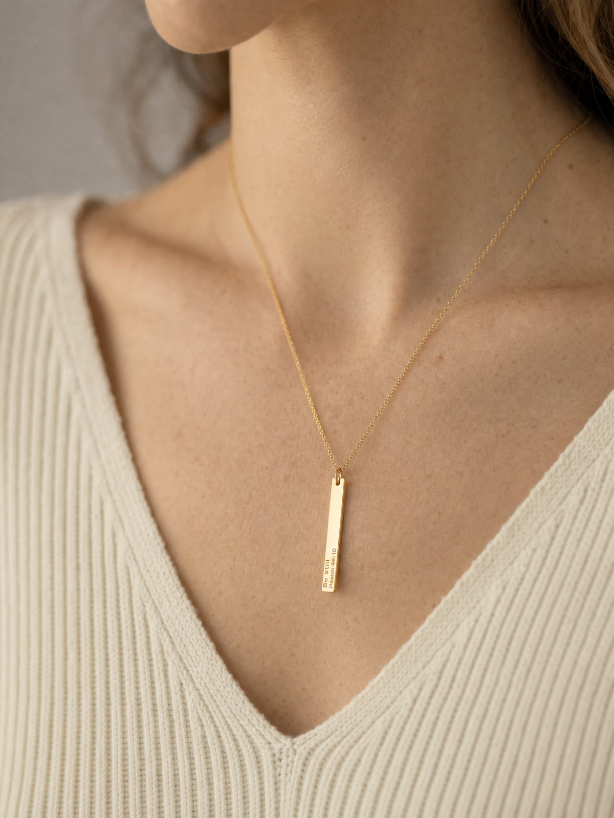SAINT GILD his promise necklace on neck