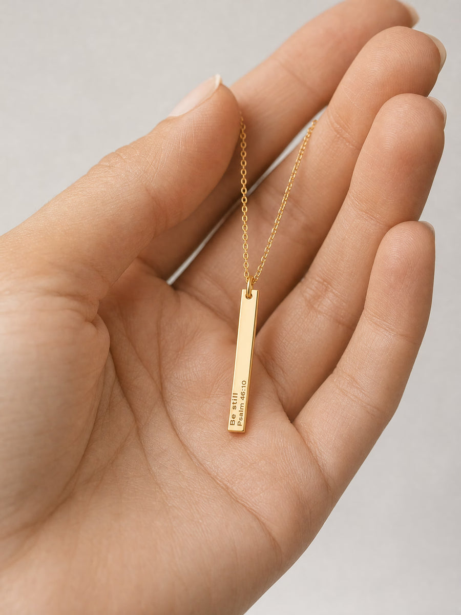 SAINT GILD his promise necklace in hand