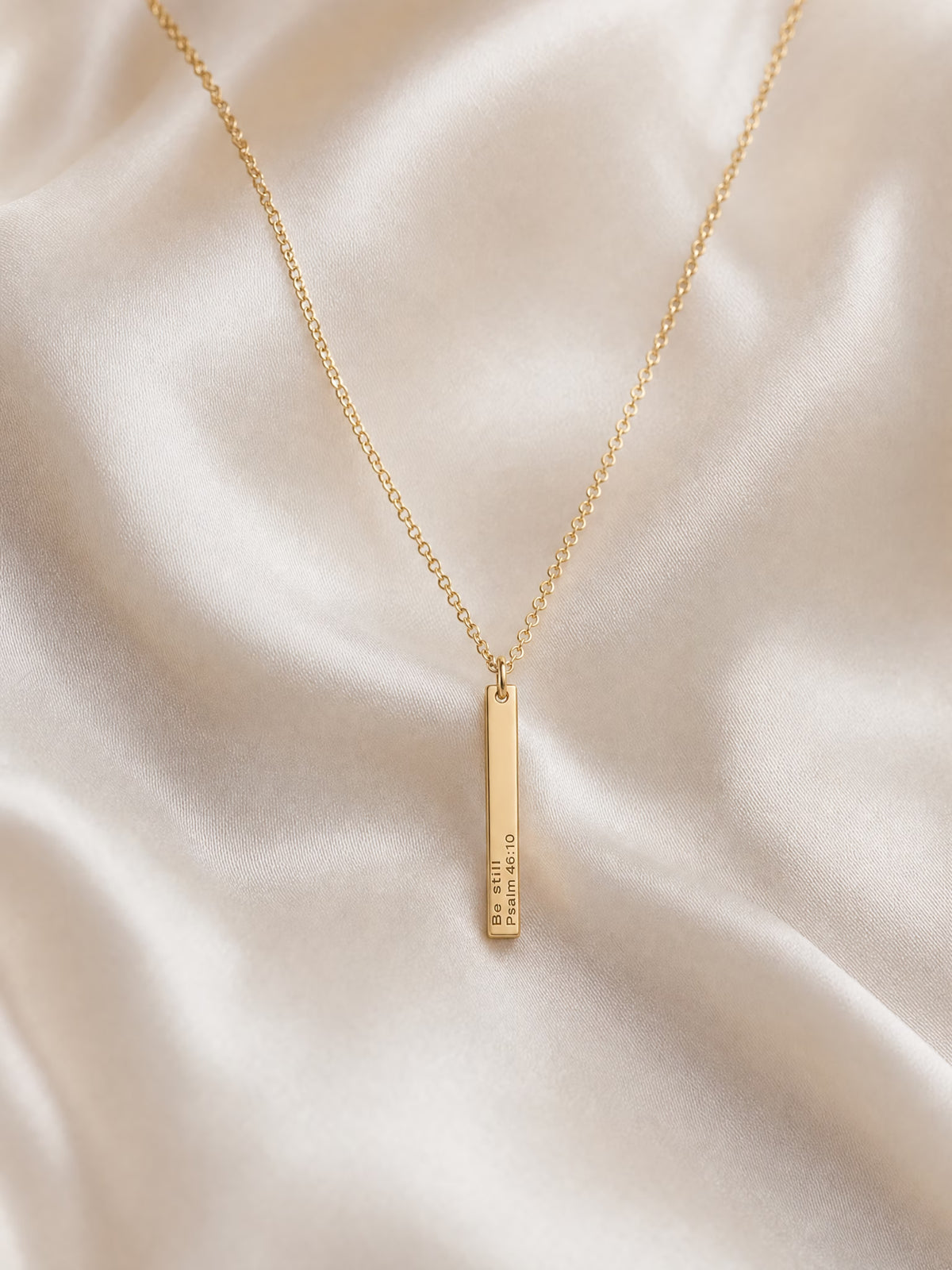 SAINT GILD his promise necklace flatlay on satin