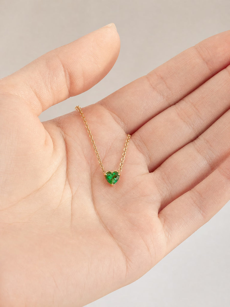 SAINT GILD birthstone heart necklace in hand