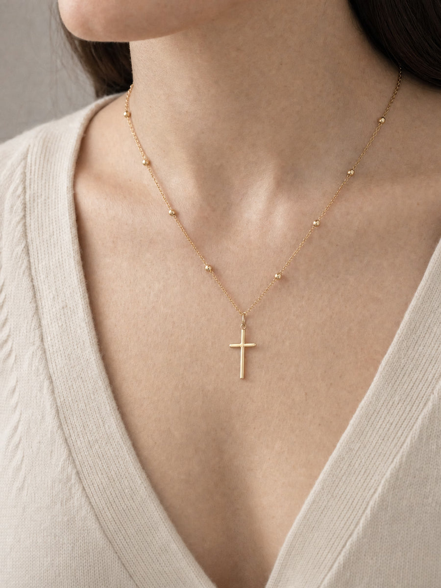 SAINT GILD Beaded Cross Necklace on neck