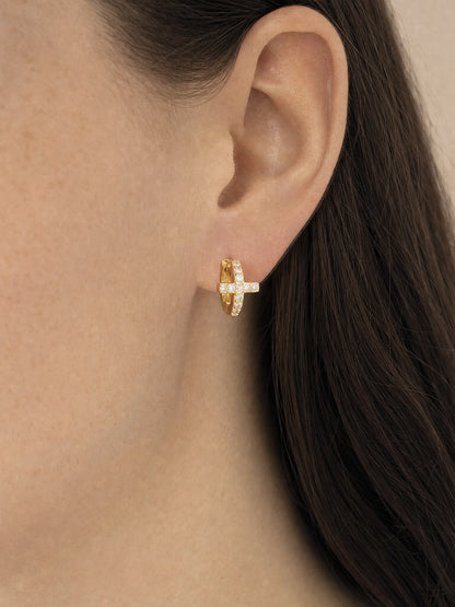 SAINT GILD Pave Cross Huggie Earrings on ear