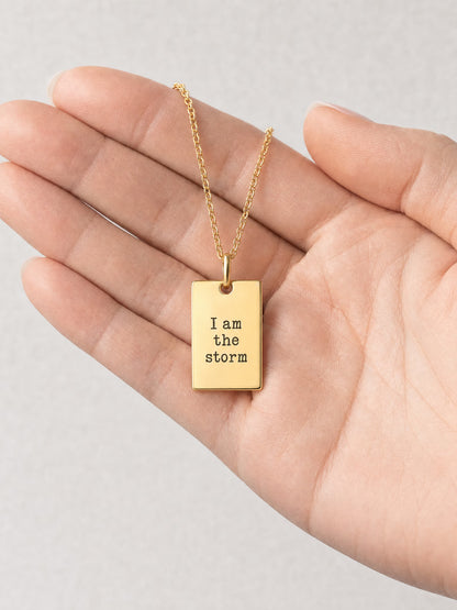 SAINT GILD Scripture Tag Necklace in hand