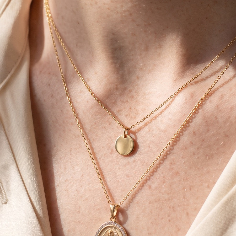 Layered gold necklaces